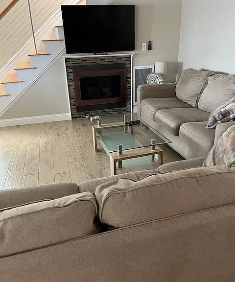 Living Room with gas fireplace and flat screen smart TV