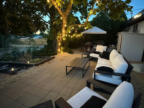 Outdoor Patio with heater, tables, and lights for entertaining