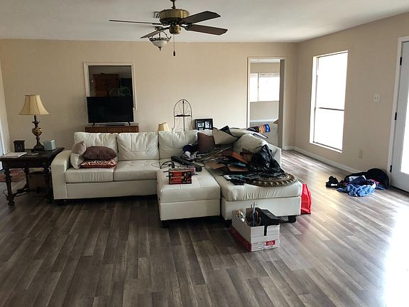 Living room with peek-a-boo window into Kitchen