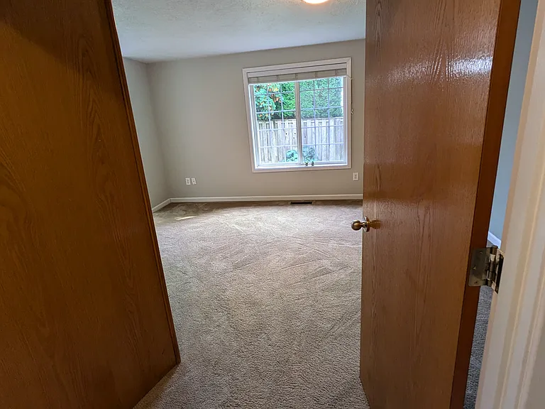 Double doors open to Primary bedroom 13' by 14' with on suite bathroom vanity and separate shower/toilet room