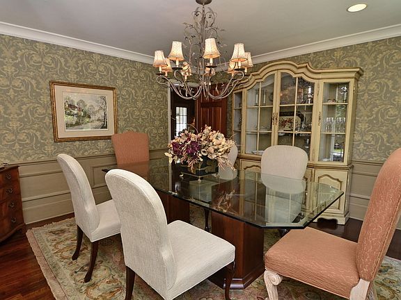 The gracious formal dining room is rich with colors and textures.