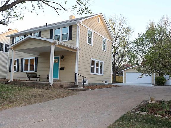 Side of house has new driveway, patio and garage