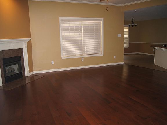 Open floor plan living room with beautiful dark, hardwood fl