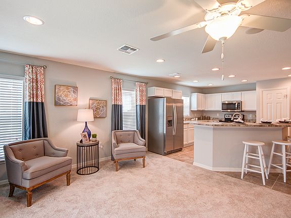 Photos showcase the Merlot home layout colors and