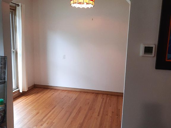 Dining room with arched doorway.