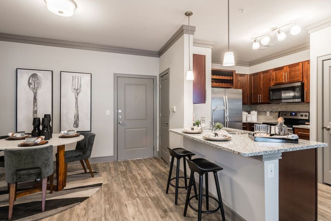 Kitchen and dining areas with hard-surface vinyl plank flooring