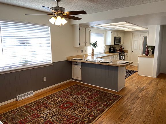 Open Kitchen With Informal Dining
And Counter Seating
Distressed Real Wood Flooring