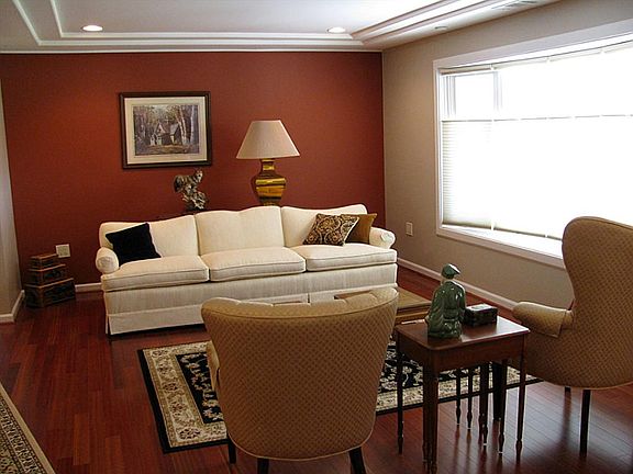 Decorator hues and Brazilian Cherry floors in formal living room