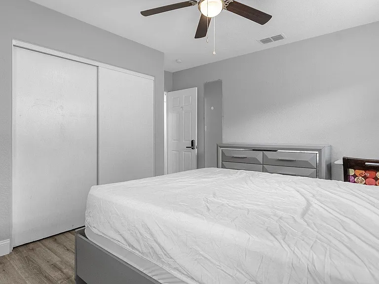 Dresser and the desk with chair is hidden behind bed