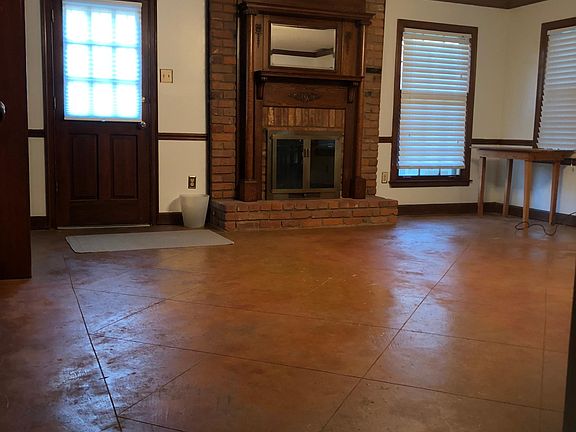 Spacious living room with wood burning fireplace