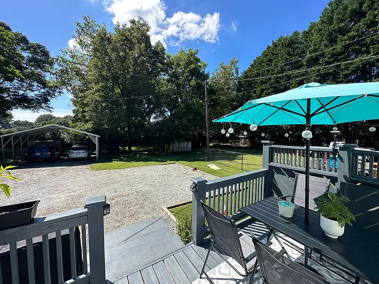 fenced in backyard, patio & carport