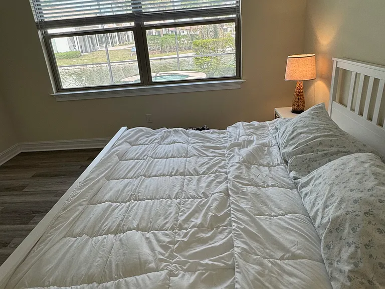 Master Bedroom with simulated wood veneer flooring.