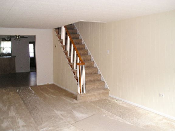 Living Room with New Carpet Paint & Drywall