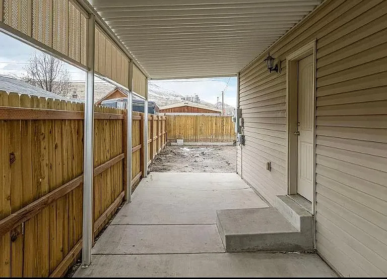 Basement entrance and covered patio.