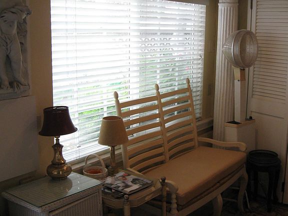 Partial view of living room/ bedroom beyond doors