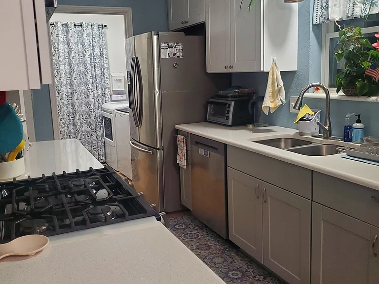 Kitchen area and laundry room.