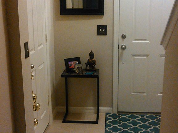 Front door view and to the left garage door entryway