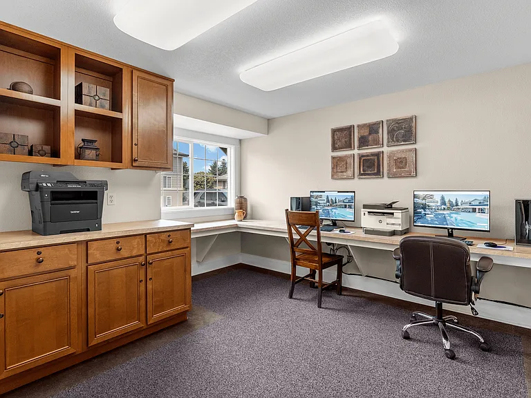 Convenient resident business center with computers and printer access.