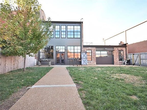 Aggregate sidewalk and patio and fenced yard perfect for entertaining!
