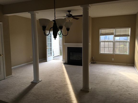 View from kitchen into living room toward back door