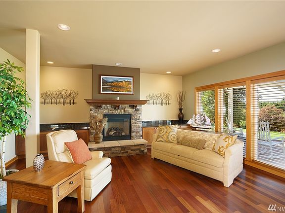 Sitting Room off of kitchen with a custom fireplace mantel 