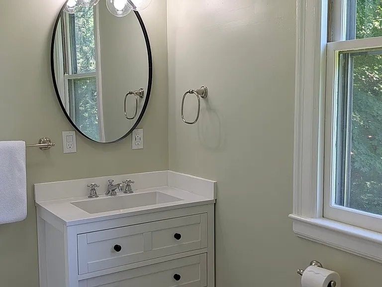 Bathroom has ceiling fan exhaust and heat. Waterproof wood look floor very easy to clean. Washer/ dryer hookups.