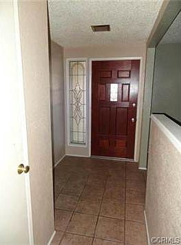 FORMAL ENTRY WAY WITH LEADED GLASS SIDE LIGHT