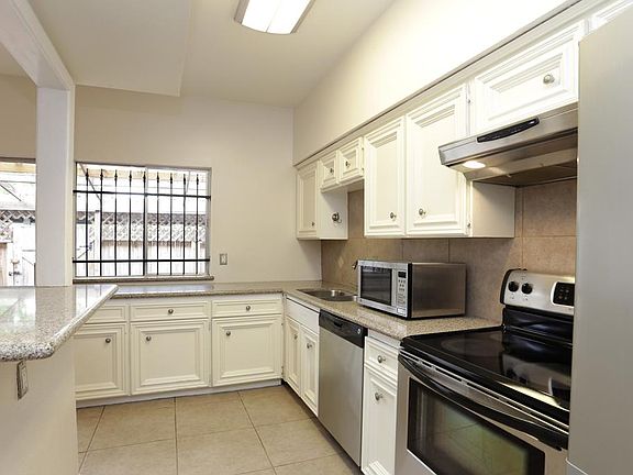 Kitchen totally redone with crushed quartz counter tops and stainless appliances.