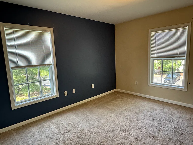 Generous Corner Bedroom with two Windows and Two Closets