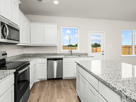 The kitchen has stainless-steel, energy-efficient appliances.