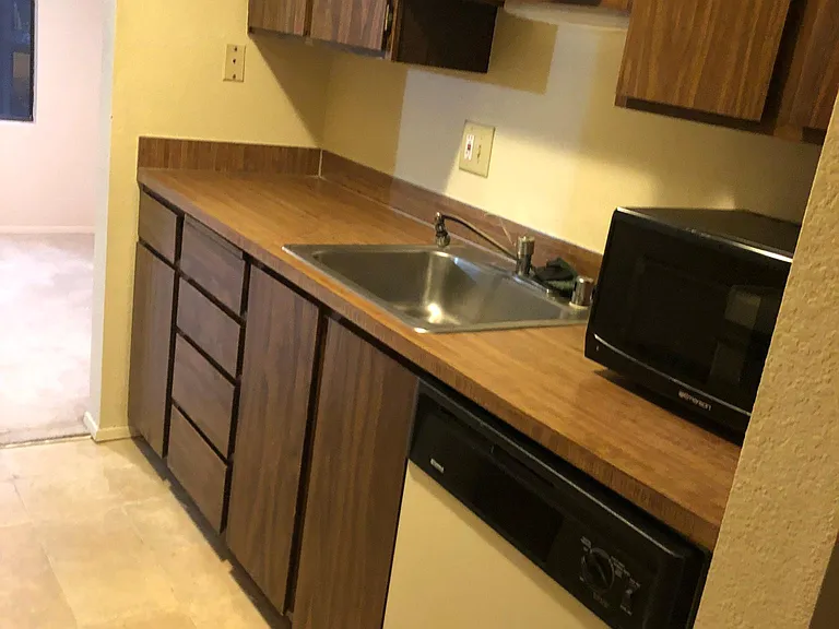 kitchen,
 Dishwasher, refrigerator/freezer, stove/Oven are all white..