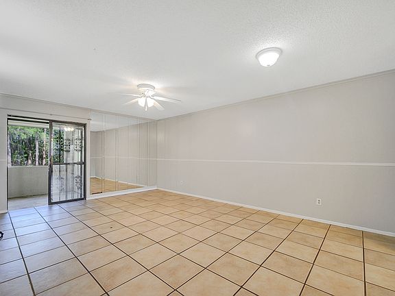 Living space with tile and ample natural light