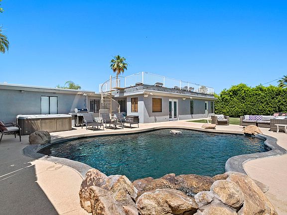 Pebble tec pool with waterfall.