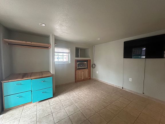 studio area with fireplace and TV