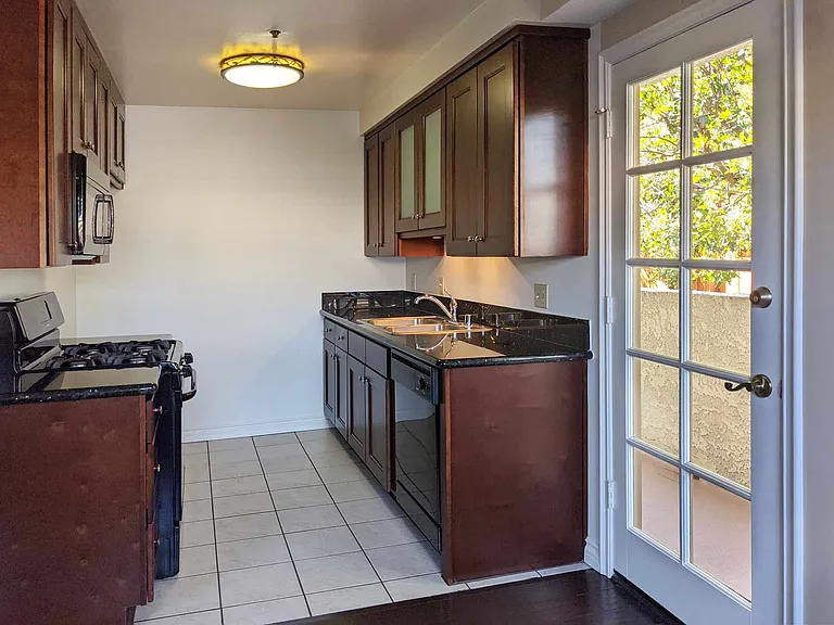 Spacious, custom cabinetry in each kitchen