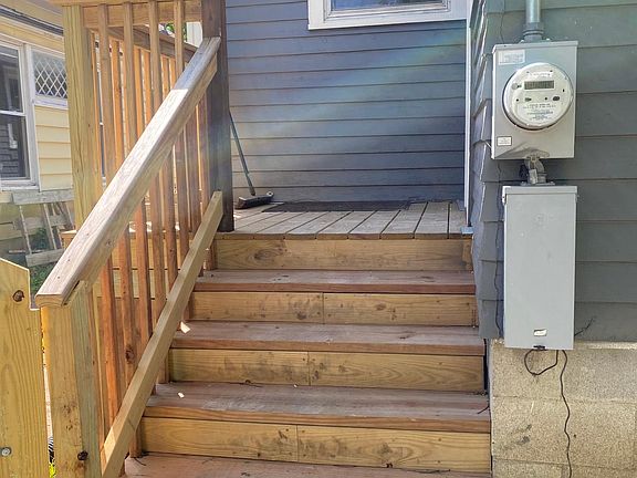 Back porch leads to back fenced yard