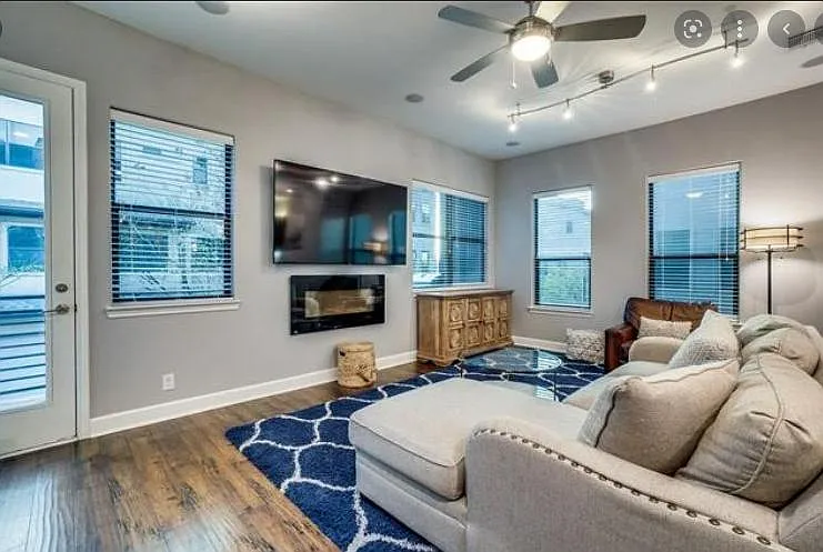 2nd Floor living room with electric fireplace and surround sound.