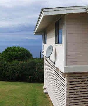 Along south side of house -- yard and ocean view.