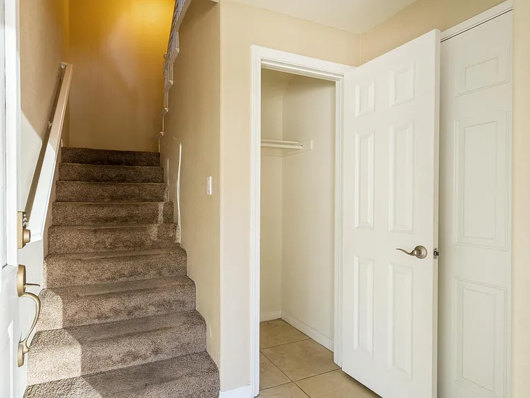 Floor 1: entryway, storage closet, and garage entry
