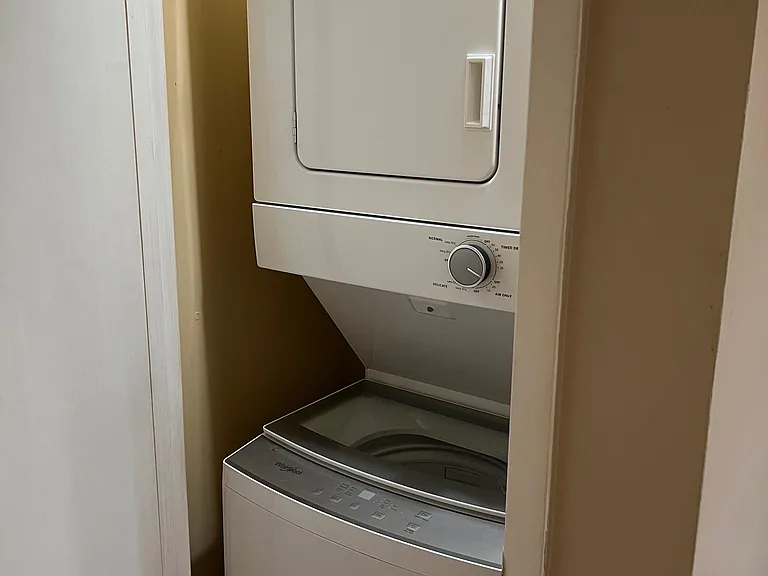 In unit Washer Dryer unit in separate area with separate door between kitchen and dining room