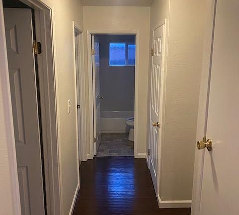 View down hallway to bedrooms and bath.