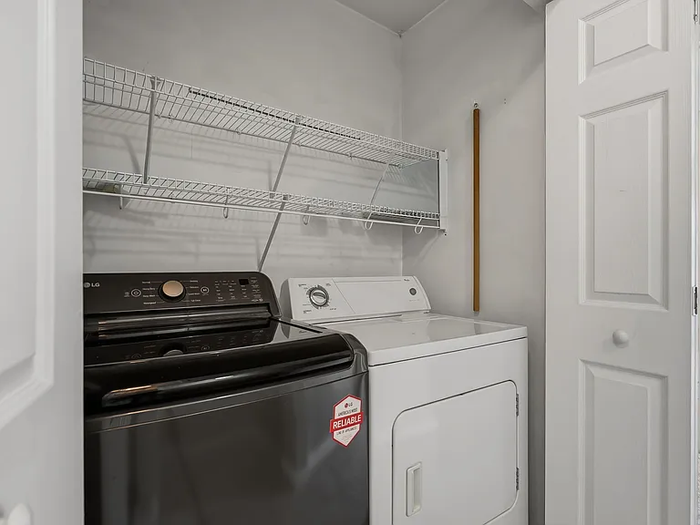 Laundry room between both third floor bedrooms