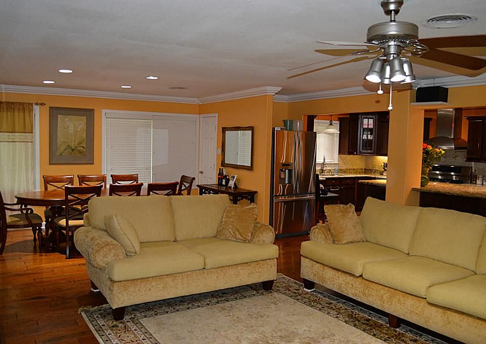 Living Room - View 1 - The living room is open to the dining, kitchen, and breakfast areas.