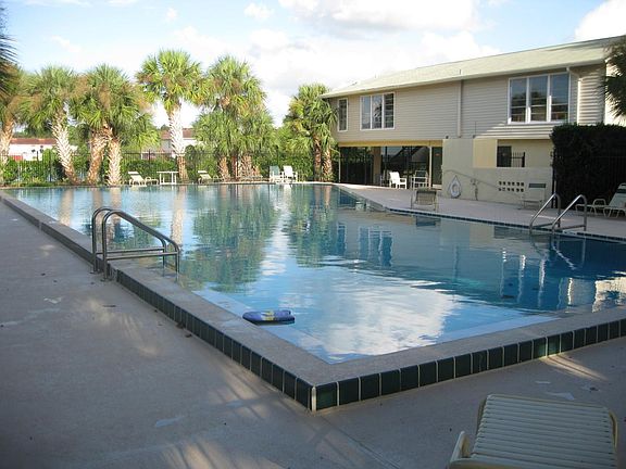 Swimming pool with clubhouse in the background