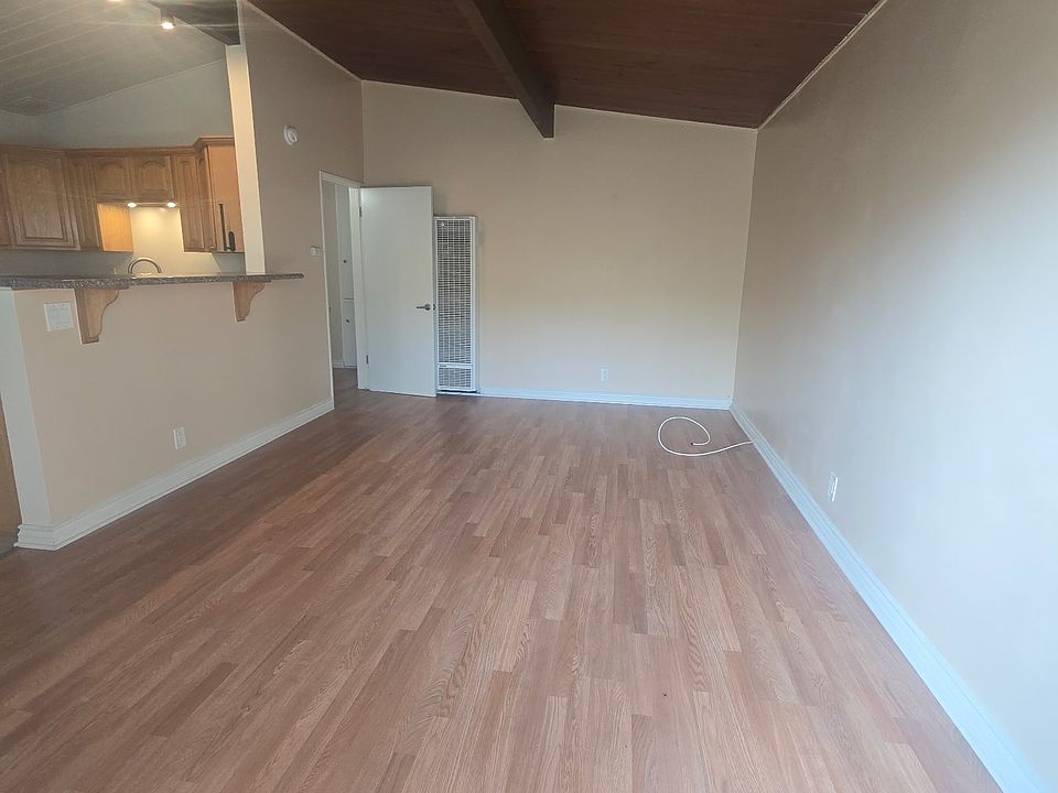 Living room as seen front front door. Kitchen is to the left.