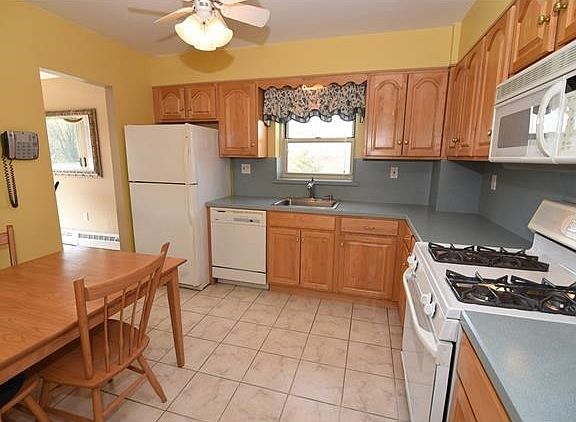 Bright eat-in-kitchen with plenty of cabinet & counter space will make entertaining for the holidays a breeze.