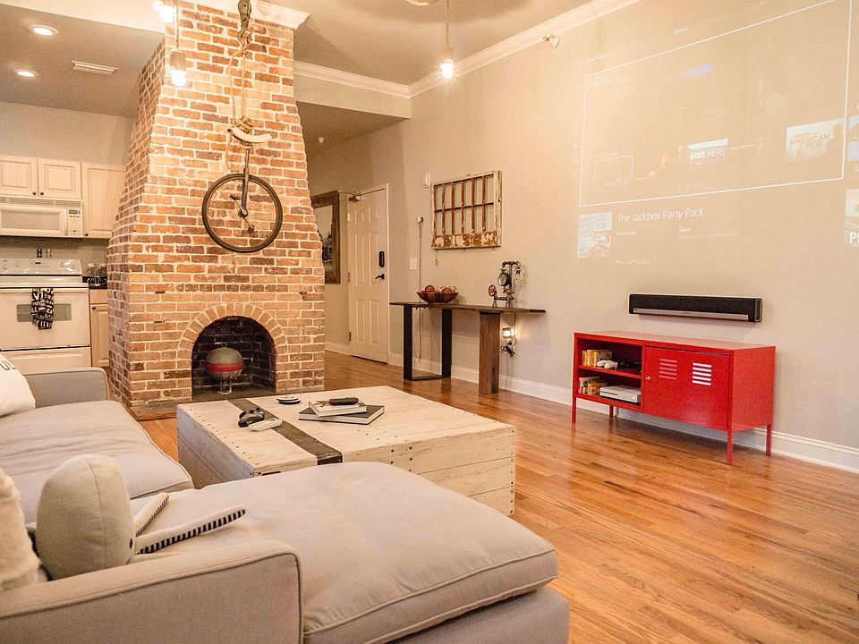 There is now a TV on the wall opposite the sofa.