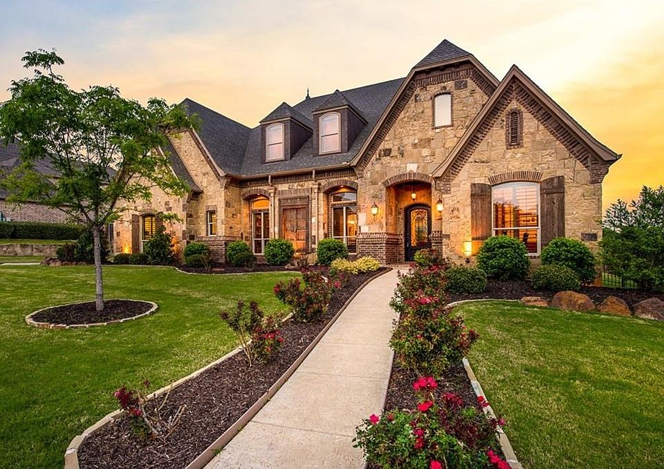 Stone and brick elevation nestled on nearly half acre lot with backyard view overlooking equestrian property. Handsome iron and rain glass entry door. Side entry drive with 3 car garage.
