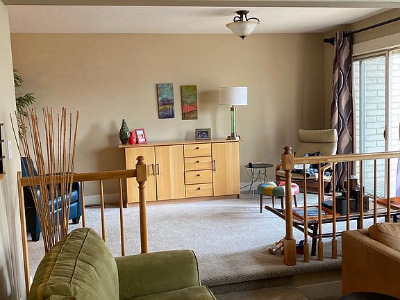 Upper sitting/reading room with doors to large patio