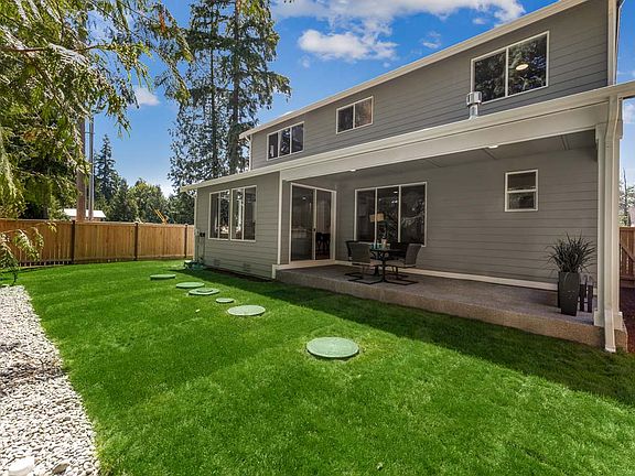Private landscaped and fenced yard with big covered patio